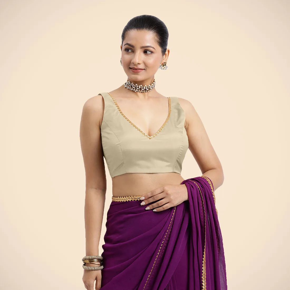 Raisa x Tyohaar | Cream Sleeveless FlexiFit™ Saree Blouse with V Neckline with Golden Gota Lace Embellishment and Back Cut-out with Tie-Up