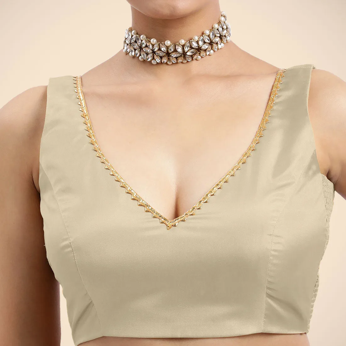 Raisa x Tyohaar | Cream Sleeveless FlexiFit™ Saree Blouse with V Neckline with Golden Gota Lace Embellishment and Back Cut-out with Tie-Up